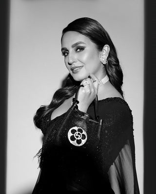 Huma Qureshi In The Crystal Poppi Bucket Bag In Midnight Black