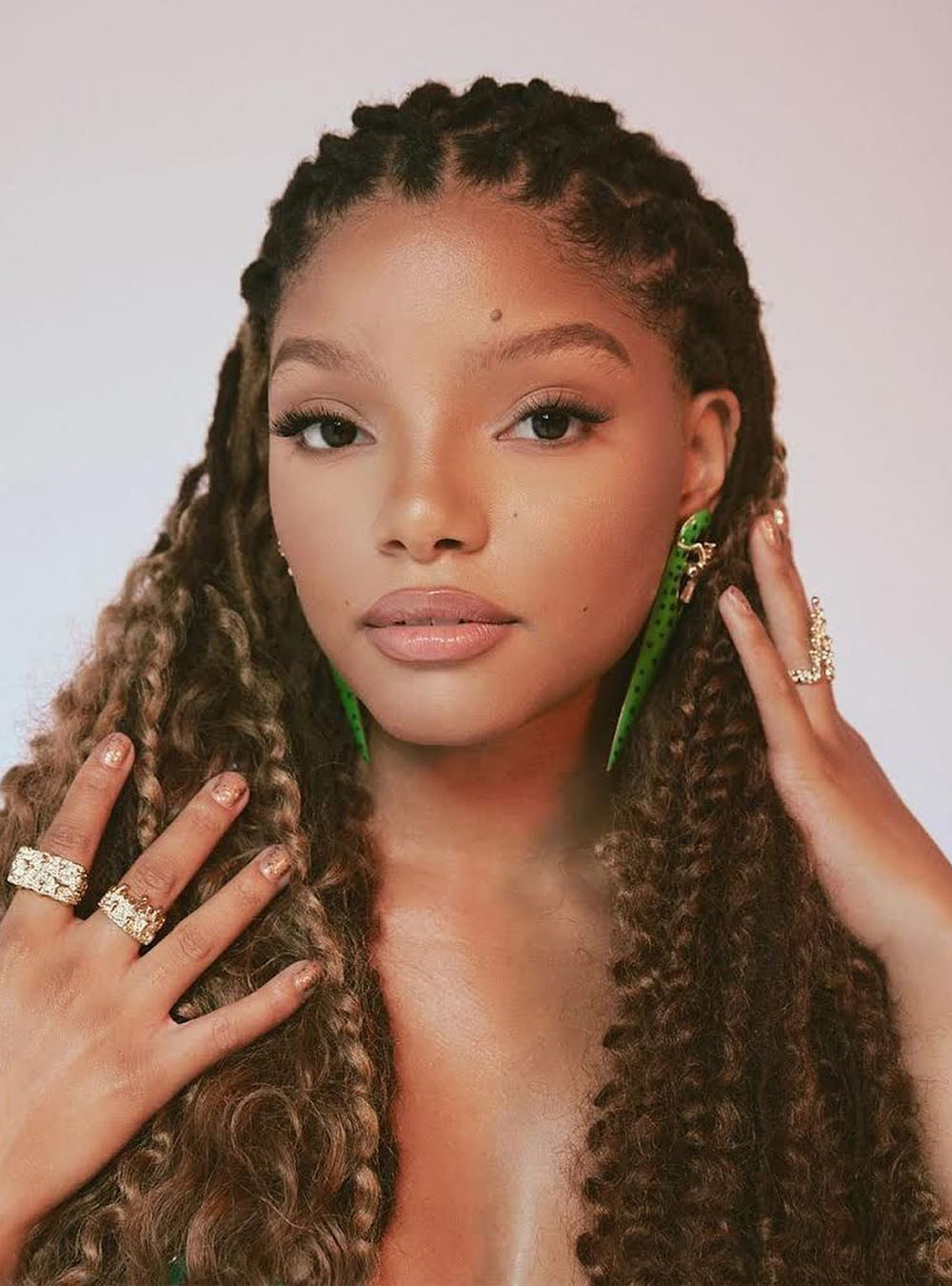 Halle Bailey Wearing Gavi Spicule Earrings In Green Leopard Enamel Fin ...