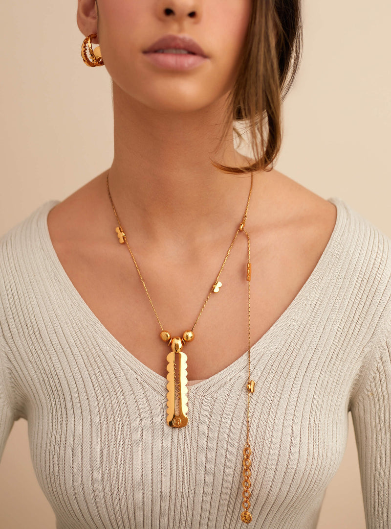 Long Gold Pendants by Outhouse