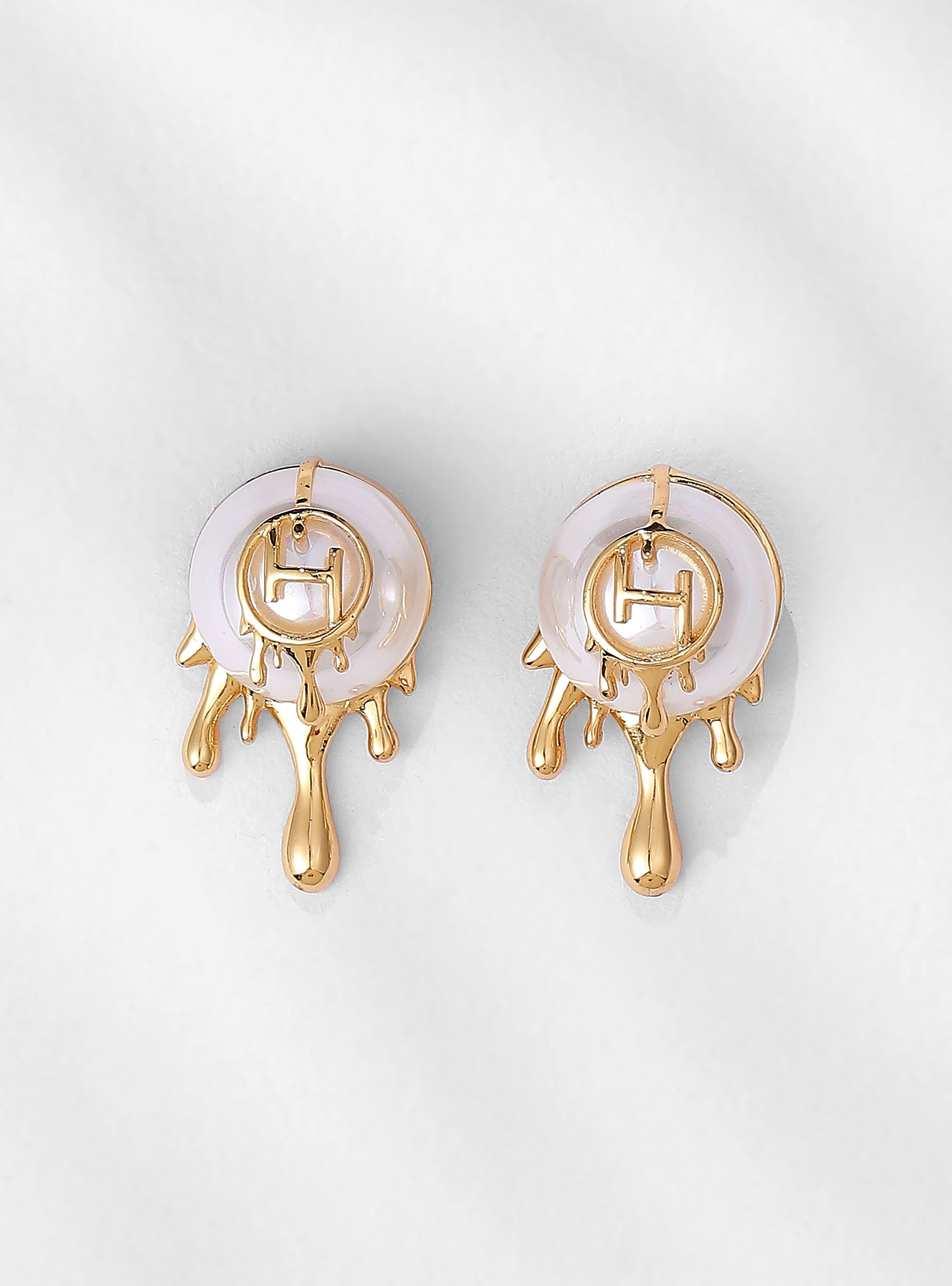 pearl stud earrings in gold finish 