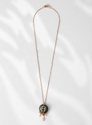 green pendant necklace with gold chain